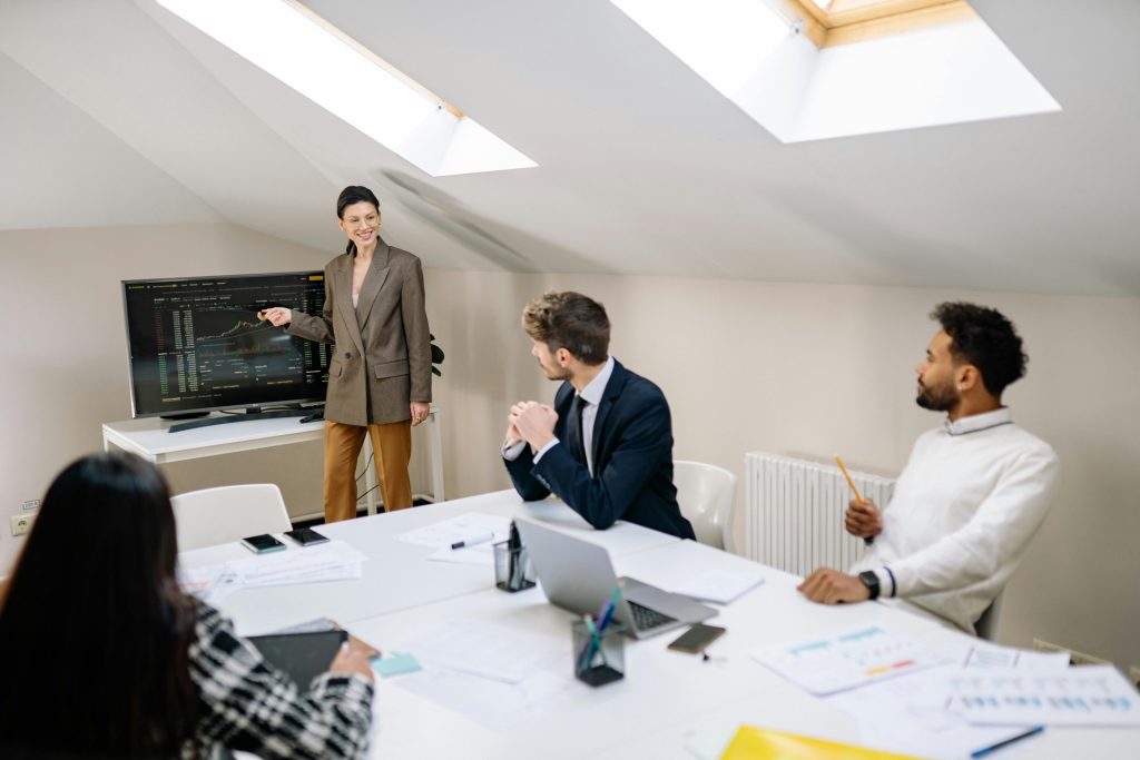 Woman-led diverse business team in collaborative procurement evaluation meeting